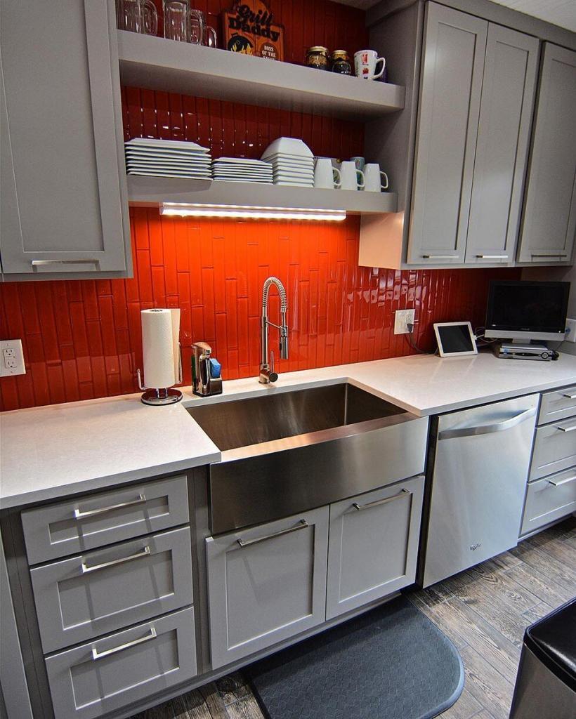 Colorfully painted kitchen with white cabinets